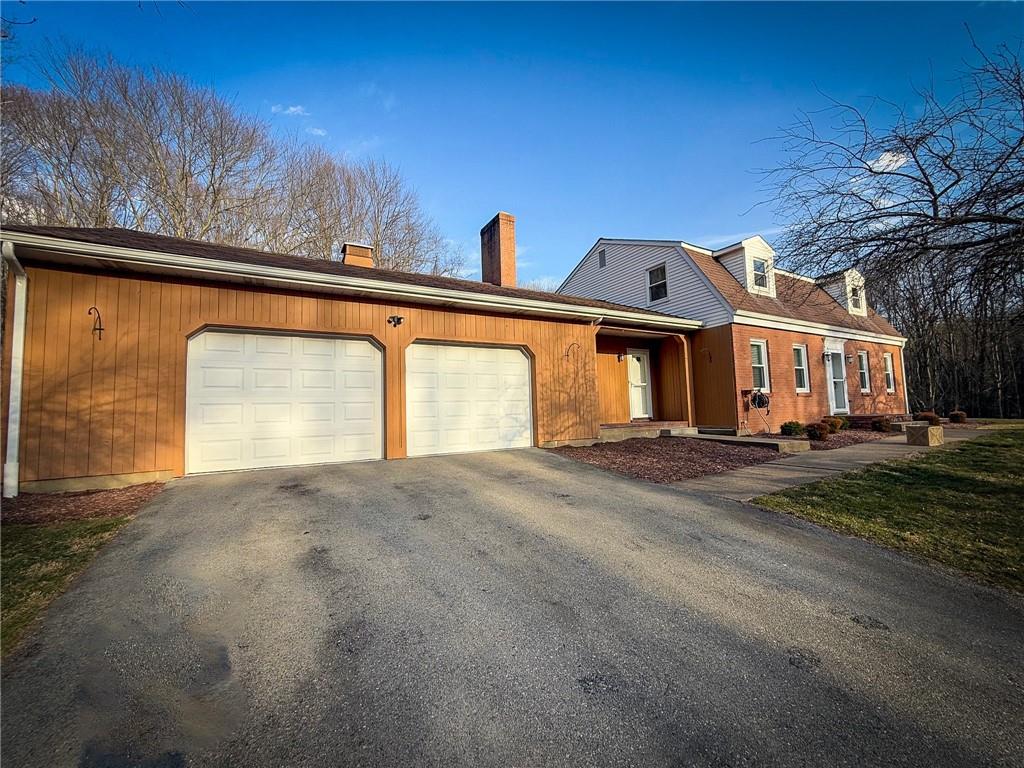 163 Crisswell Road Butler, PA 16002 - Photo 41 of 46 a front view of a house with a yard and garage
