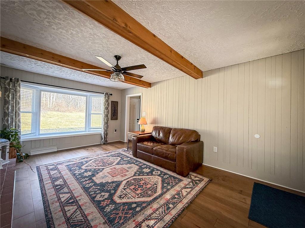 163 Crisswell Road Butler, PA 16002 - Photo 7 of 46 a living room with furniture and a rug