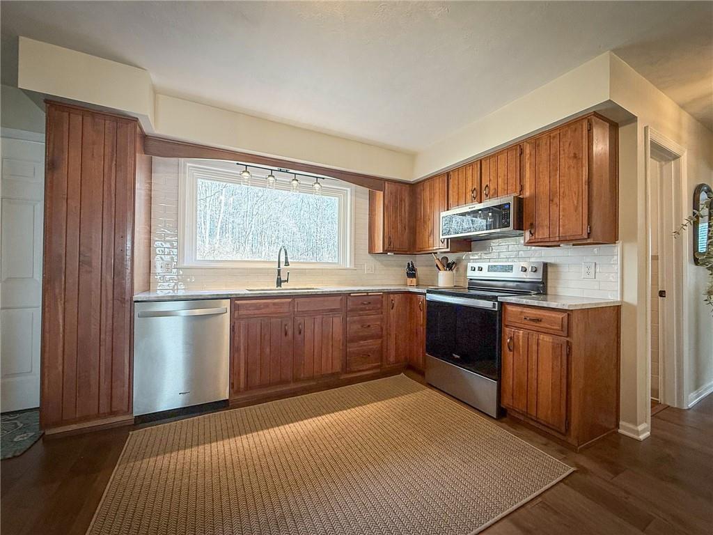 163 Crisswell Road Butler, PA 16002 - Photo 10 of 46 a kitchen with stainless steel appliances granite countertop a refrigerator sink and cabinets