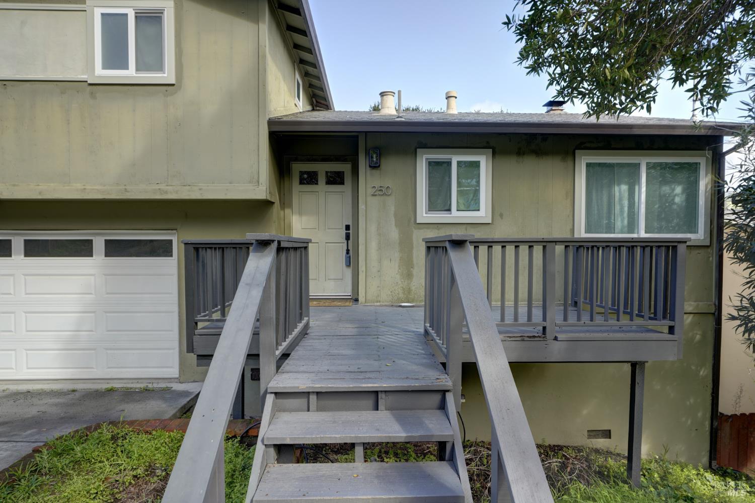 250 Prospect Drive San Rafael, CA 94901 - Photo 3 of 46 a view of a small house with wooden deck
