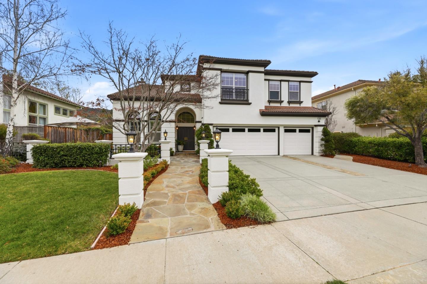 a front view of a house with a yard