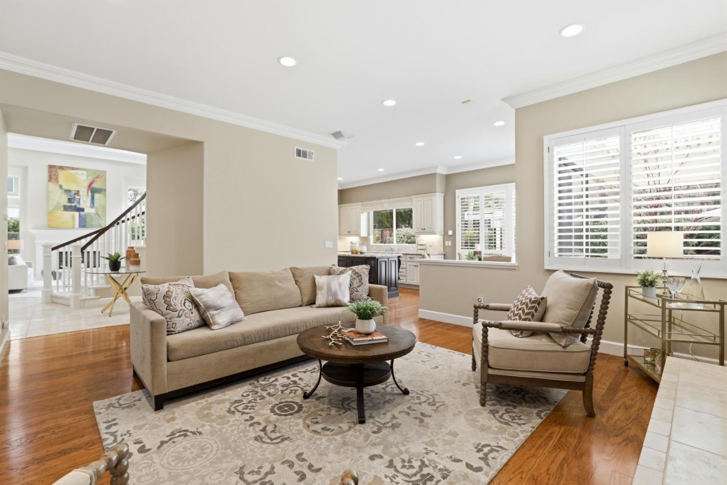1134 Falcon Ridge Court San Jose, CA 95120 - Photo 11 of 63 a living room with furniture or couch and a dining table with wooden floor