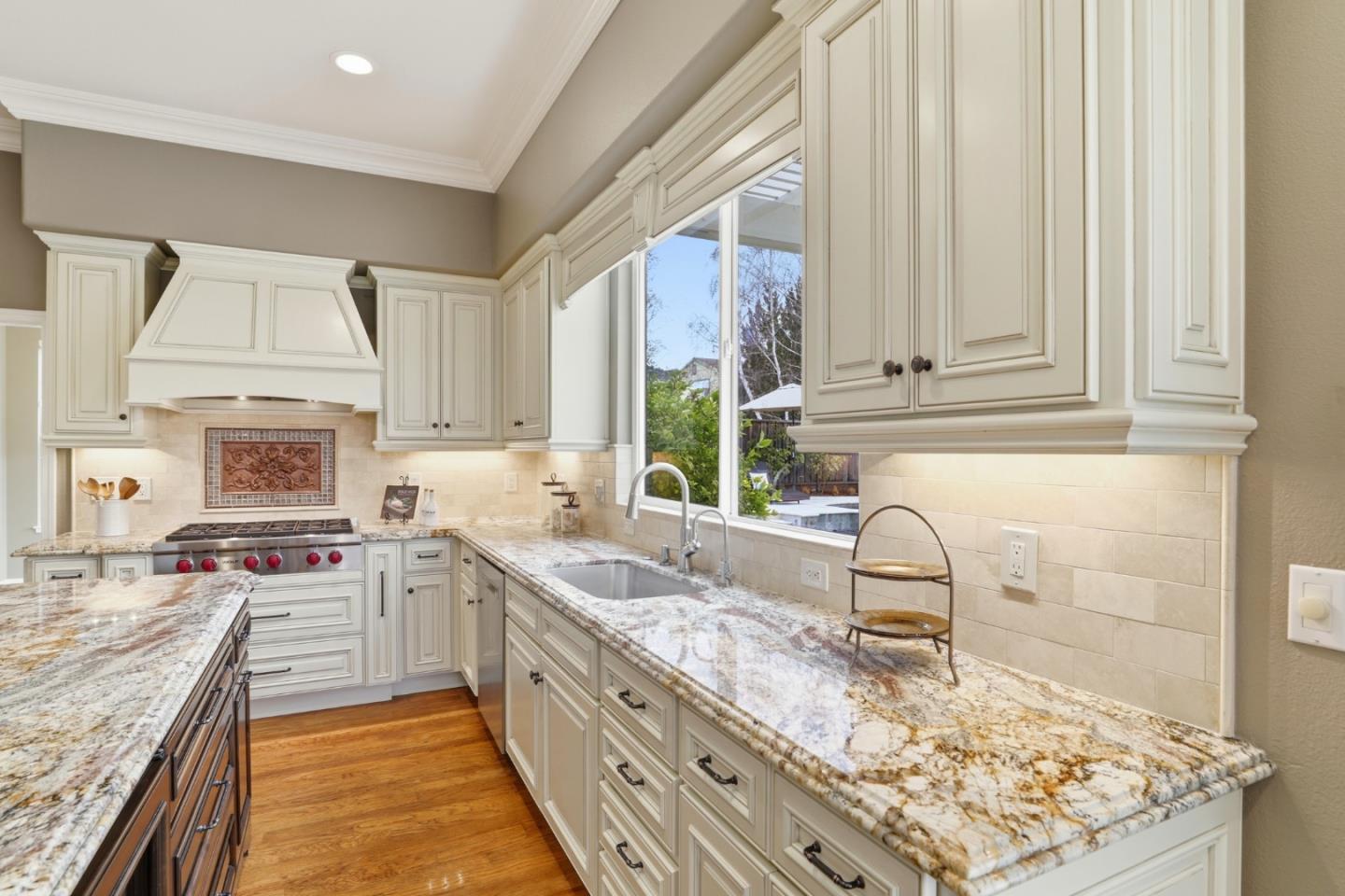 1134 Falcon Ridge Court San Jose, CA 95120 - Photo 14 of 63 a kitchen with a stove a sink and a refrigerator