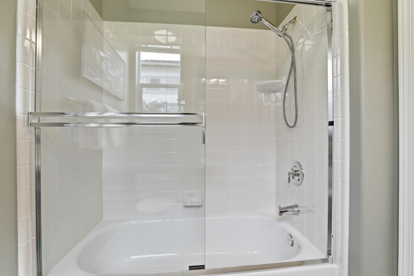 1134 Falcon Ridge Court San Jose, CA 95120 - Photo 36 of 63 a bathroom with a bath tub with a glass door shower