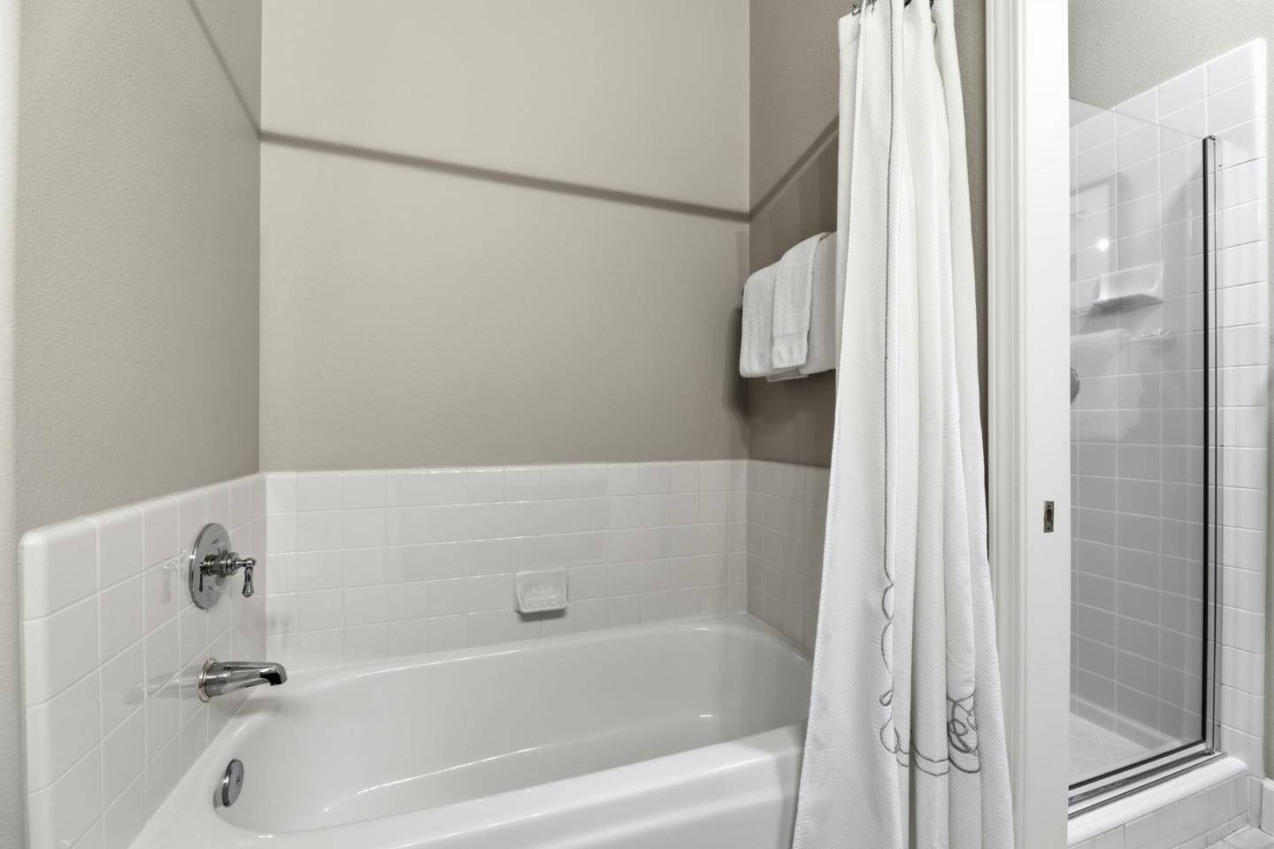 1134 Falcon Ridge Court San Jose, CA 95120 - Photo 40 of 63 a bathroom with a bathtub and a shower
