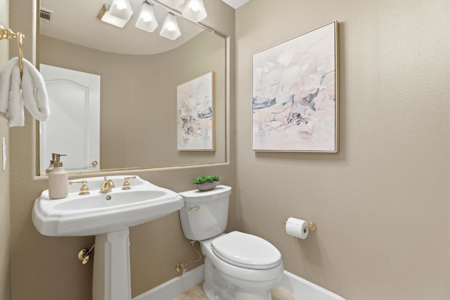 1134 Falcon Ridge Court San Jose, CA 95120 - Photo 41 of 63 a bathroom with a toilet sink and mirror