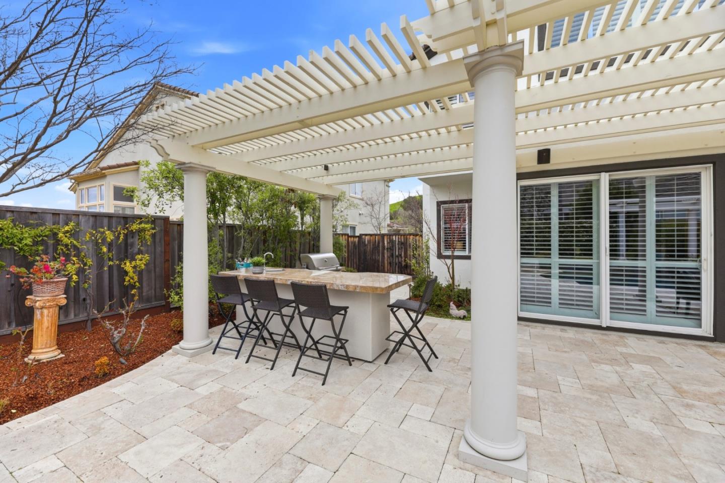 1134 Falcon Ridge Court San Jose, CA 95120 - Photo 45 of 63 a view of a patio with a table and chairs and potted plants