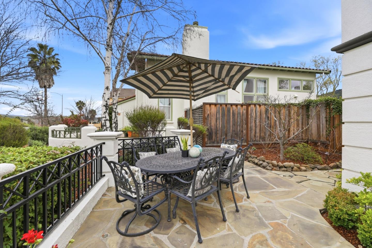 1134 Falcon Ridge Court San Jose, CA 95120 - Photo 47 of 63 a patio with glass top table and chairs