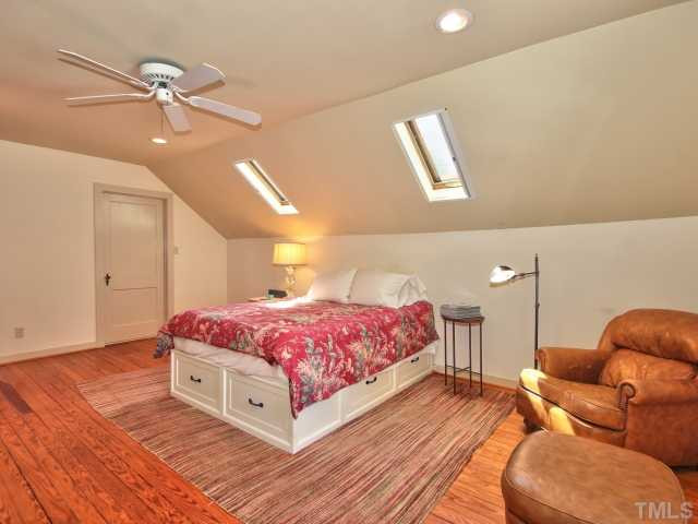 2710 Kilgore Avenue Raleigh, NC 27607 - Photo 15 of 24 Large master suite with hardwoods, skylights with privacy shades, sconce lighting, ceiling fan and storage