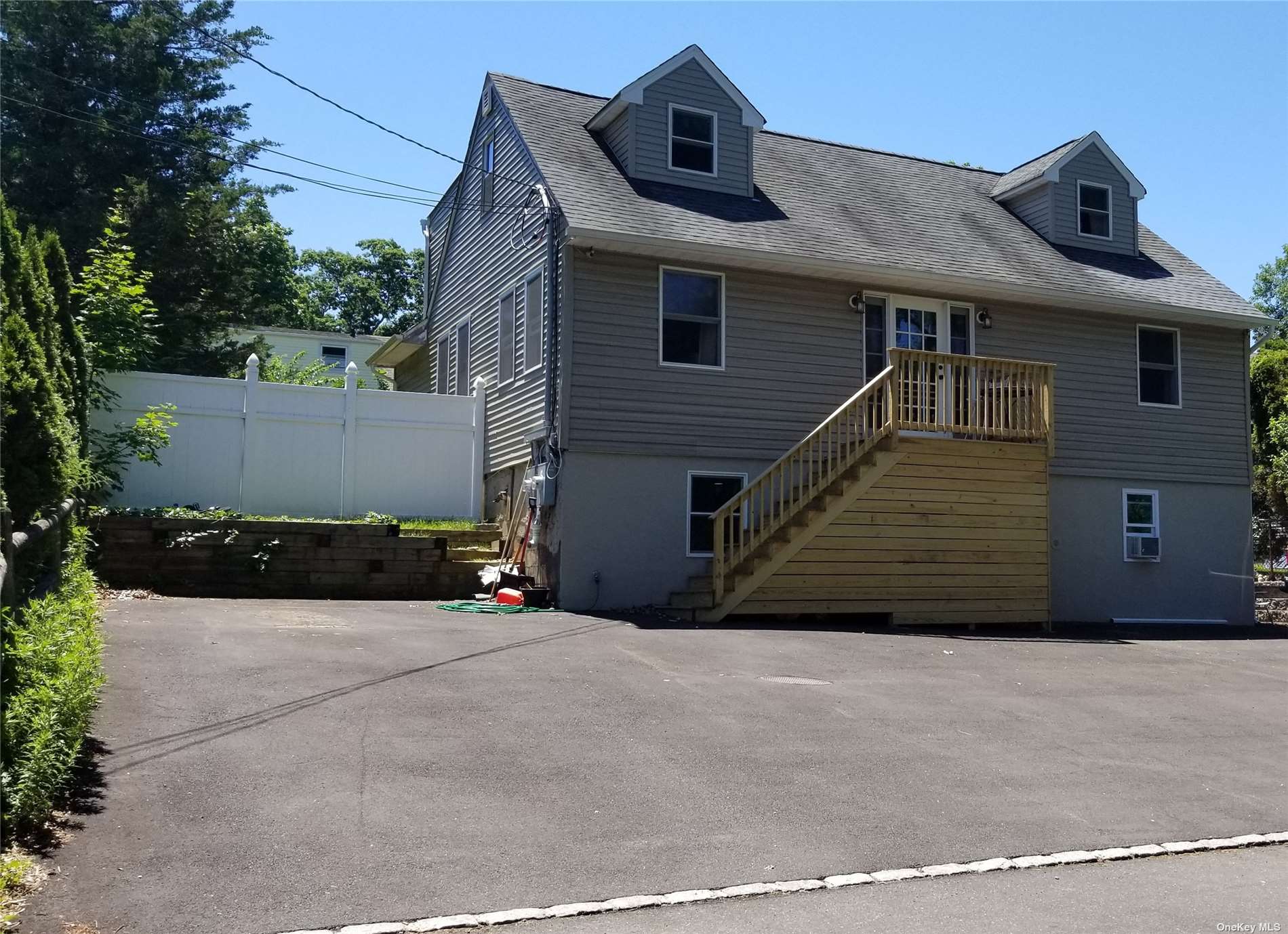 20 Triton Road Rocky Point, NY 11778 - Photo 1 of 1 a front view of a house with a garage