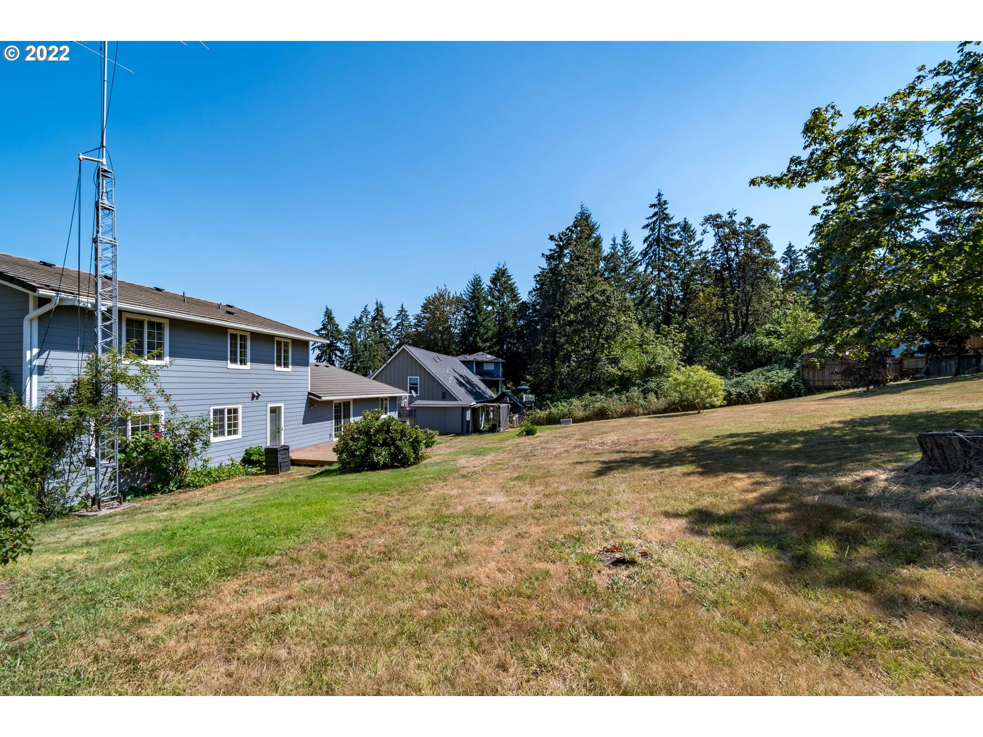 South 67th Springfield, OR 97478 - Photo 2 of 5 a view of a yard with plants and a bench