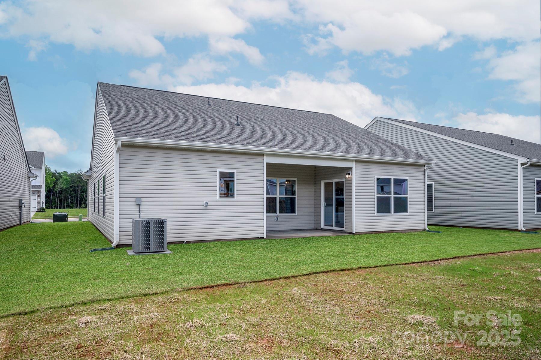 7015 Jerimoth Drive Charlotte, NC 28215 - Photo 2 of 9 a view of a house with a yard and large tree