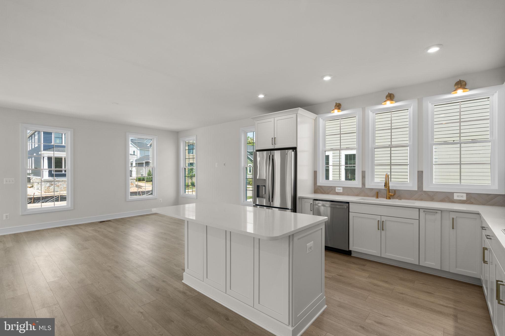 1013 Captain Richards Court Marshall, VA 20115 - Photo 11 of 44 a large kitchen with kitchen island a sink stainless steel appliances and cabinets
