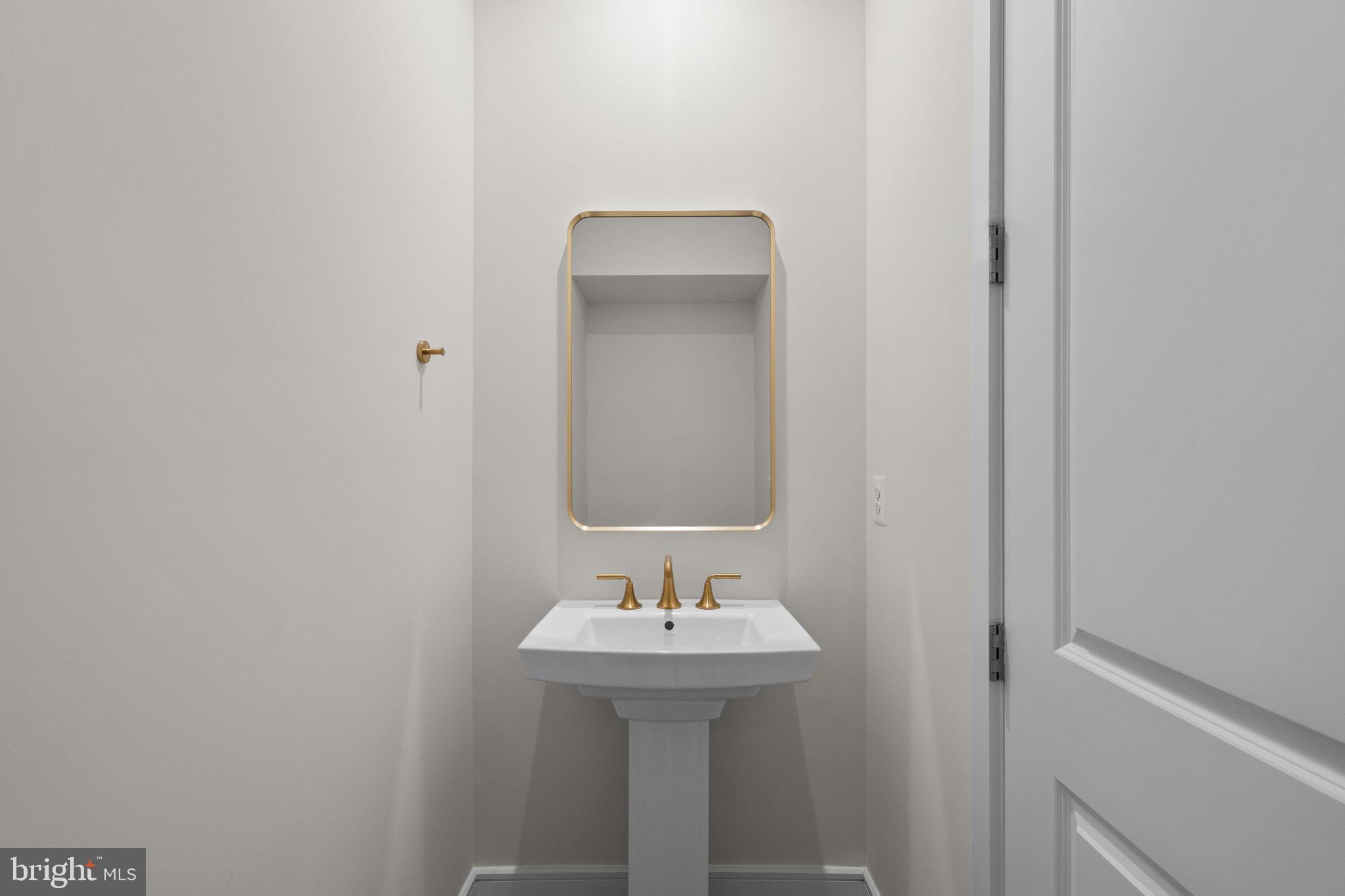 1013 Captain Richards Court Marshall, VA 20115 - Photo 16 of 44 a bathroom with a sink and a mirror