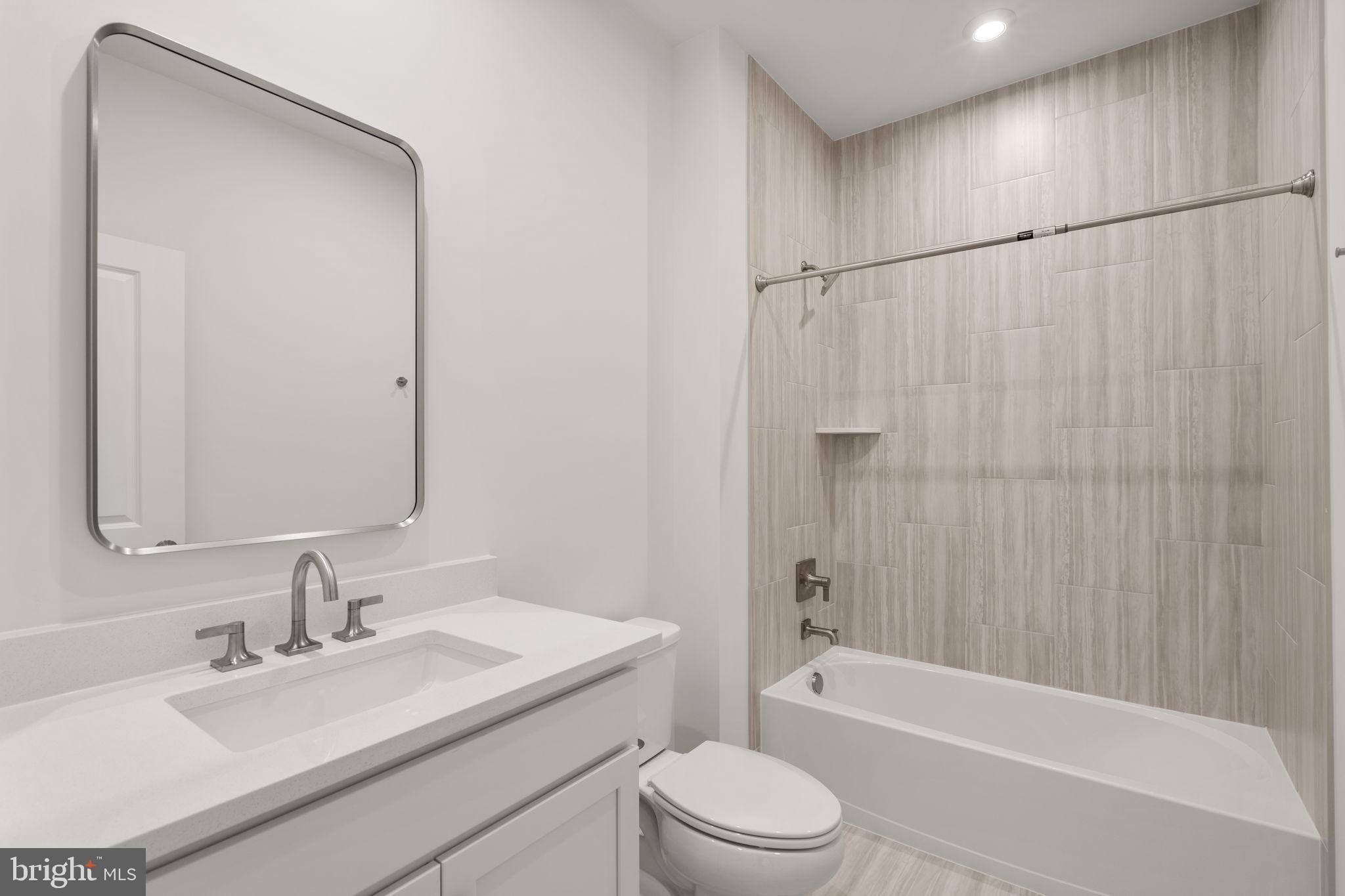 1013 Captain Richards Court Marshall, VA 20115 - Photo 20 of 44 a bathroom with a bathtub shower sink vanity and toilet