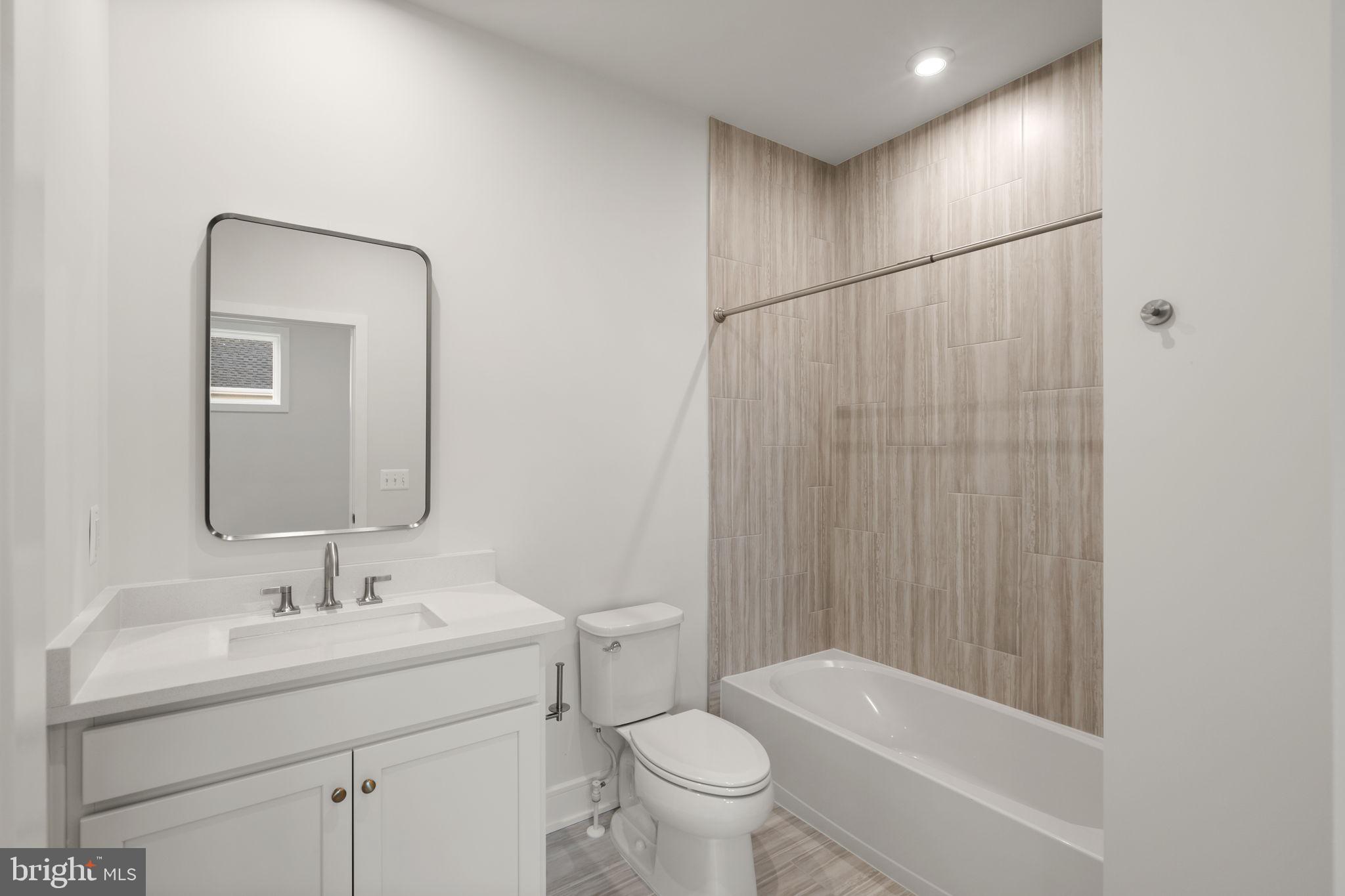 1013 Captain Richards Court Marshall, VA 20115 - Photo 23 of 44 a bathroom with a granite countertop sink a toilet and shower