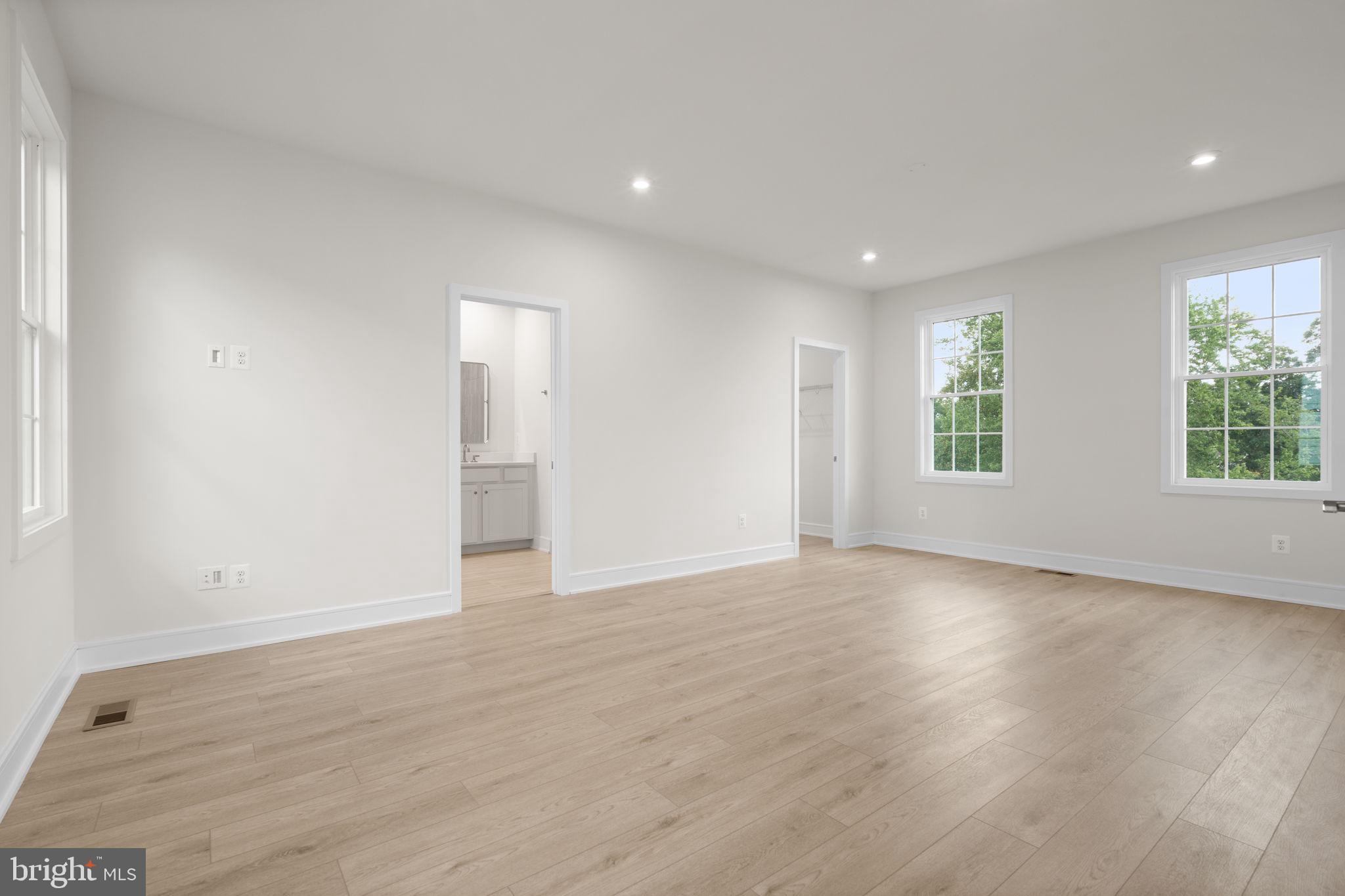 1013 Captain Richards Court Marshall, VA 20115 - Photo 24 of 44 an empty room with wooden floor and windows