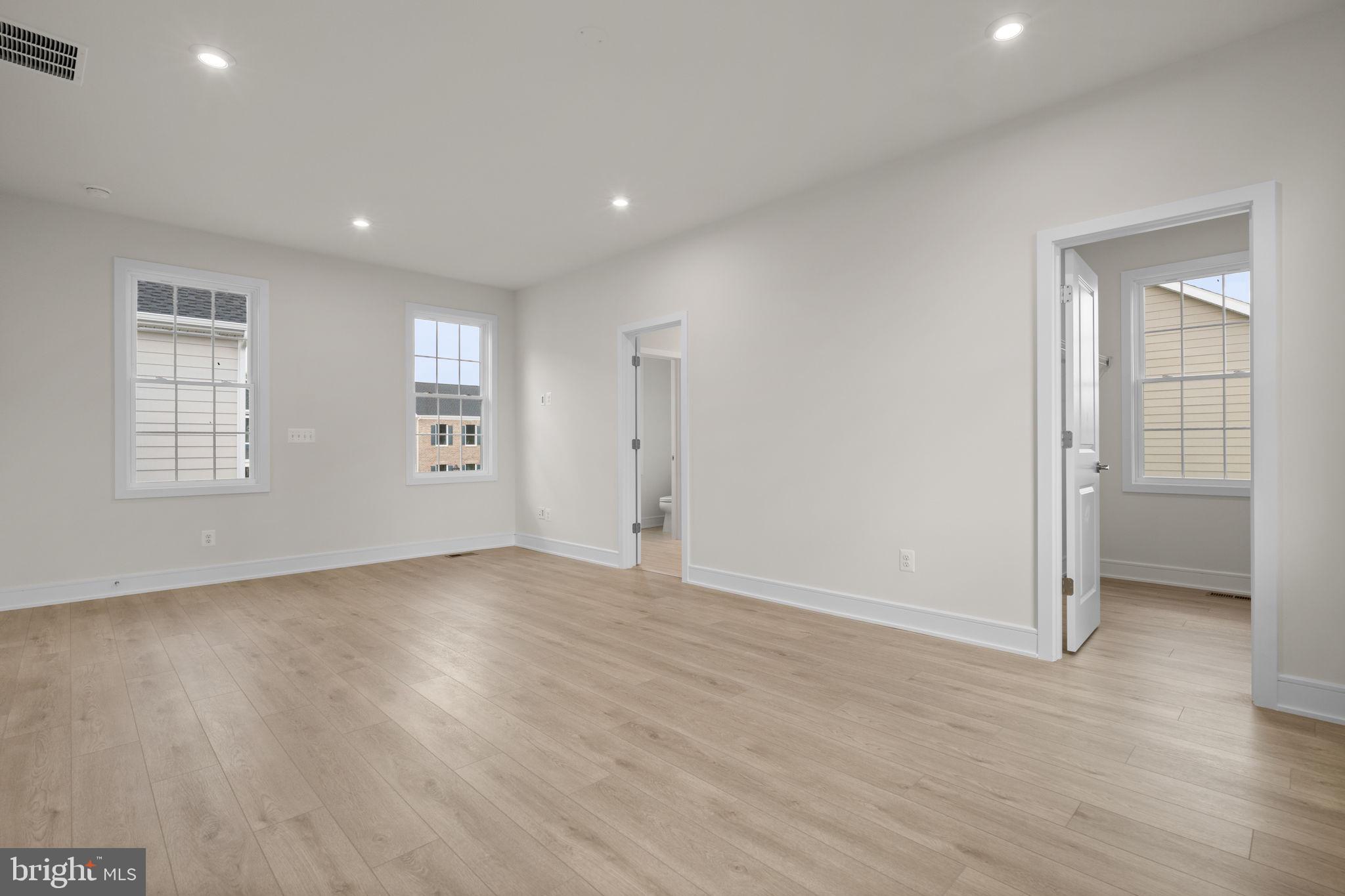 1013 Captain Richards Court Marshall, VA 20115 - Photo 26 of 44 an empty room with wooden floor and windows