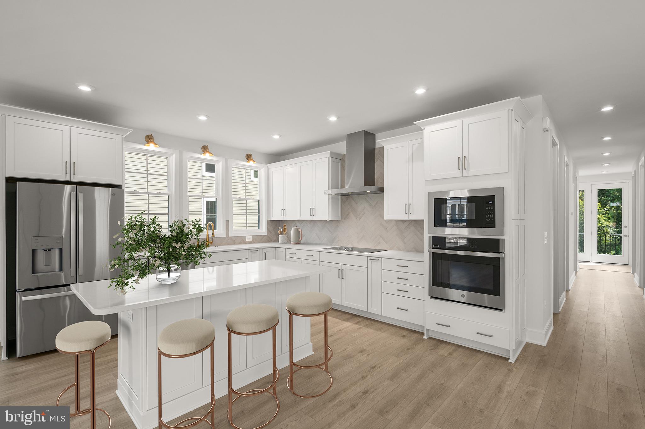 1013 Captain Richards Court Marshall, VA 20115 - Photo 4 of 44 a kitchen with granite countertop a stove a sink and a refrigerator with wooden floor