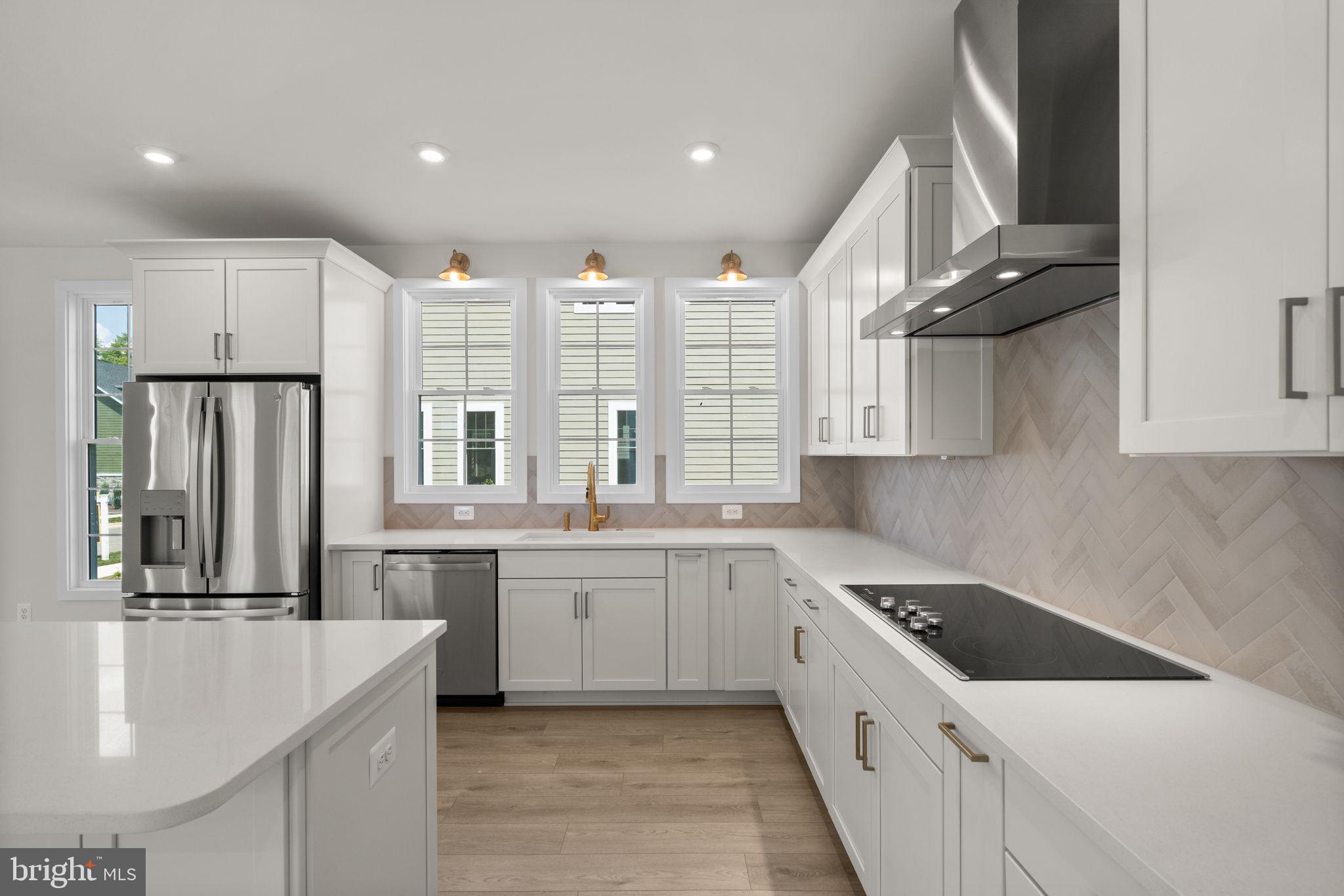 1013 Captain Richards Court Marshall, VA 20115 - Photo 10 of 44 a large kitchen with a large counter top a sink stainless steel appliances and cabinets