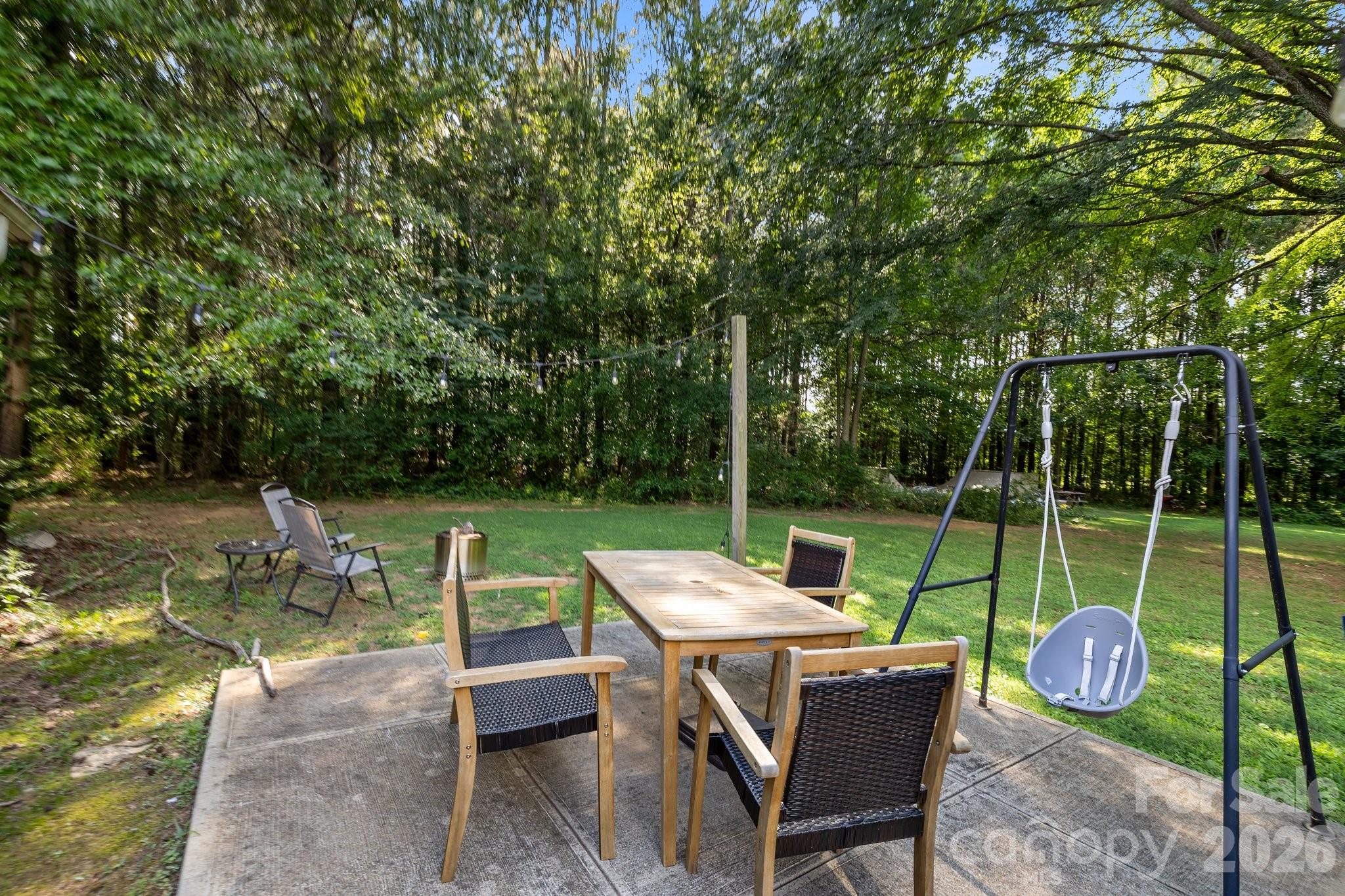 1108 Willoughby Road Monroe, NC 28110 - Photo 28 of 48 a view of an chairs and table in patio