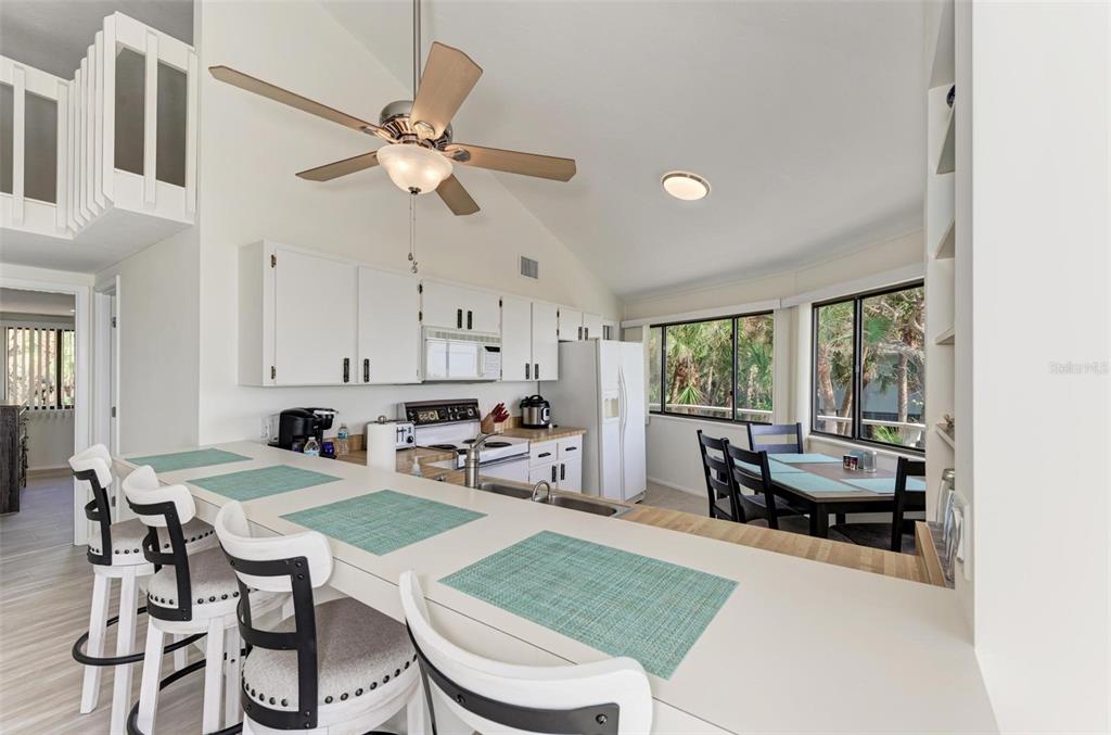 6590 Manasota Key Road Englewood, FL 34223 - Photo 19 of 69 a view of a dining room with furniture window and outside view