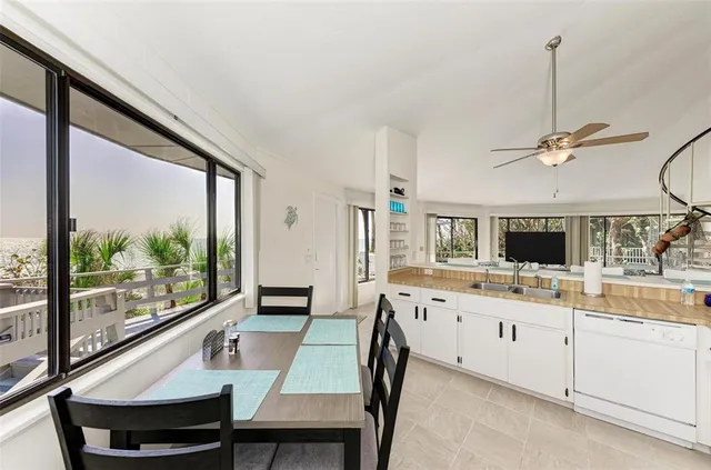 a bedroom with a large bed and a large window