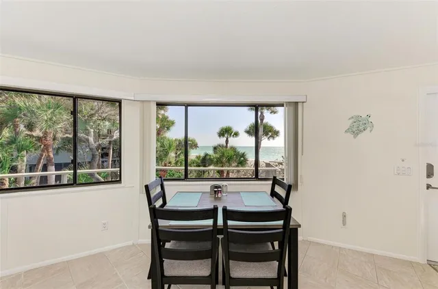 a bathroom with a granite countertop sink a mirror a vanity and a shower