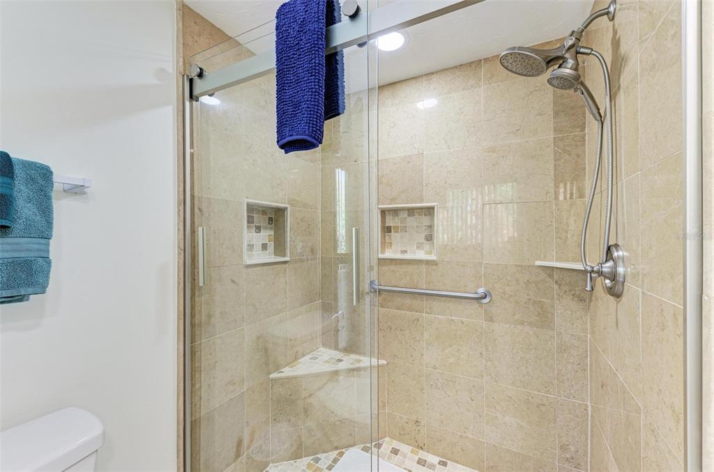 6590 Manasota Key Road Englewood, FL 34223 - Photo 29 of 69 a bathroom with a shower and a toilet
