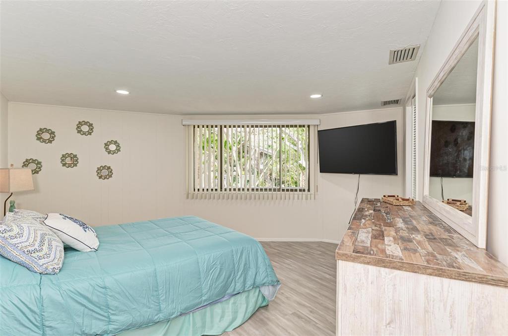 6590 Manasota Key Road Englewood, FL 34223 - Photo 30 of 69 a bedroom with a bed and window