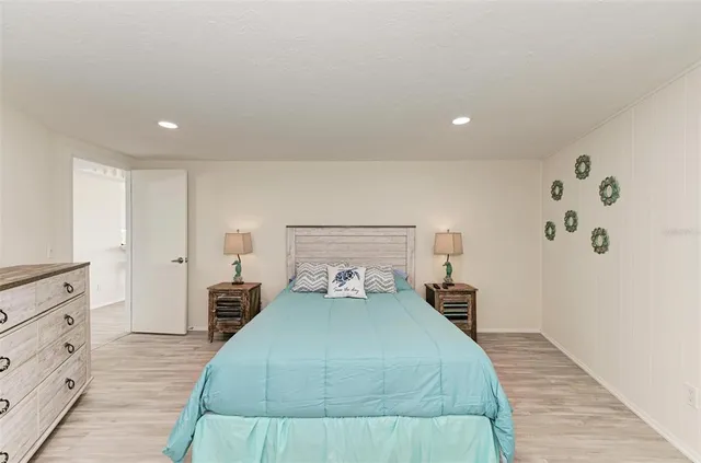 a view of hallway with wooden floor