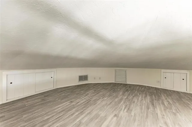 a view of an outdoor space with furniture and umbrella