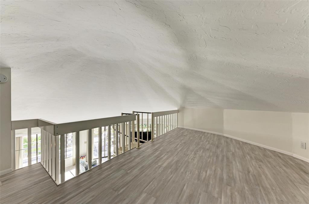 6590 Manasota Key Road Englewood, FL 34223 - Photo 36 of 69 a view of hallway with wooden floor