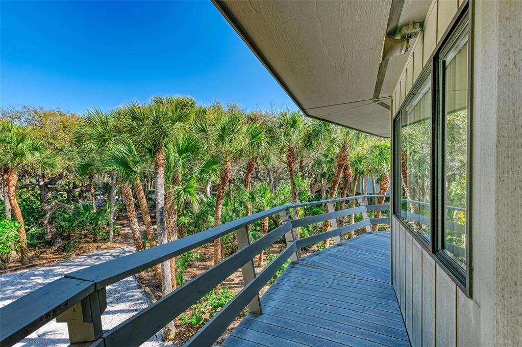 6590 Manasota Key Road Englewood, FL 34223 - Photo 42 of 69 a view of a balcony with wooden floor
