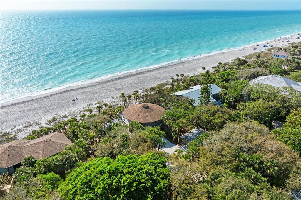 6590 Manasota Key Road Englewood, FL 34223 - Photo 67 of 69 an aerial view of a house with a yard and lake view