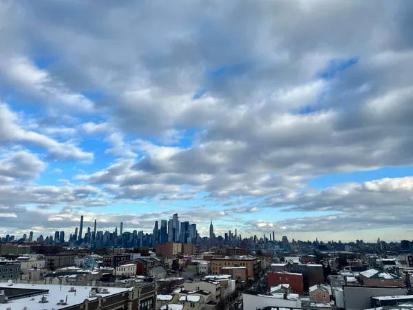a kitchen with stainless steel appliances granite countertop a stove and a refrigerator