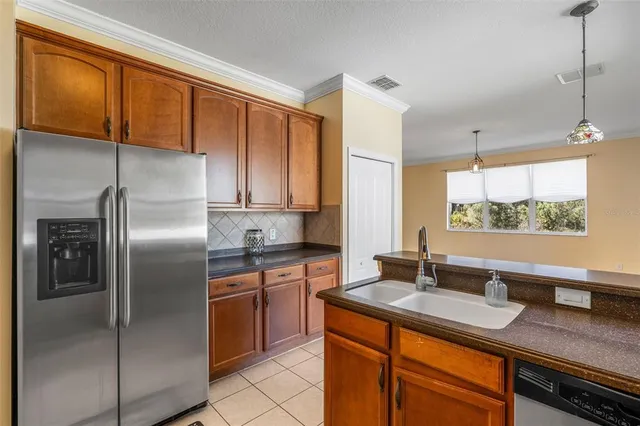a bathroom with a granite countertop toilet sink and mirror
