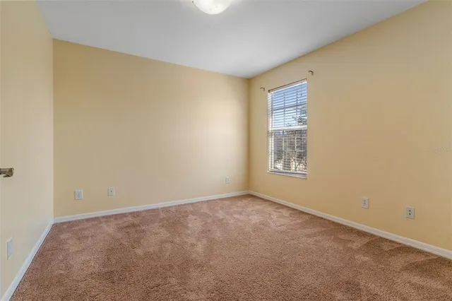 a bathroom with a bathtub a window and a shower