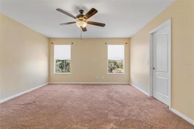 a white toilet sitting next to a shower