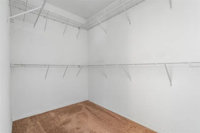 a view of a room with lots of storage and utility room