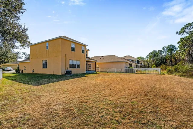 a view of a swimming pool with a yard