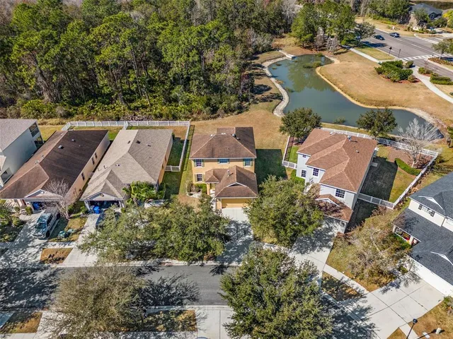 a view of a house with backyard sitting area and slide