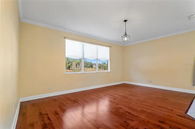 a view of a kitchen with a sink and a refrigerator