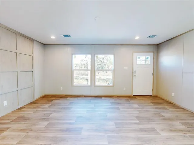 a view of an empty room and window