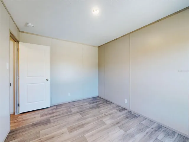 a bathroom with double sink and a mirror