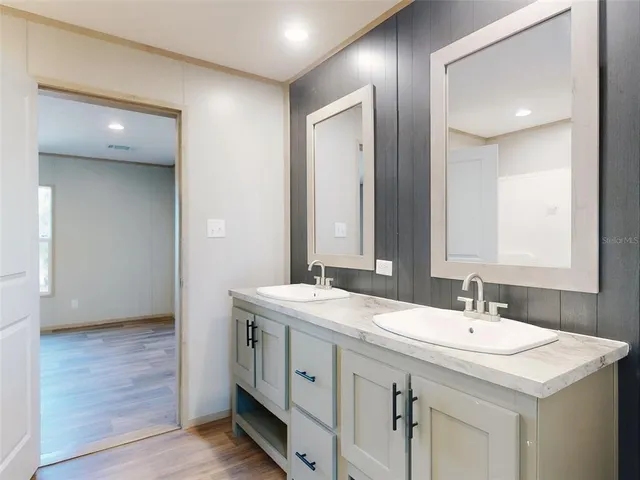 a view of a garden with plants and a bench