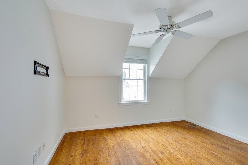 10 Rivard Road, Unit 10 Needham, MA 02492 - Photo 17 of 29 wooden floor in an empty room with a window