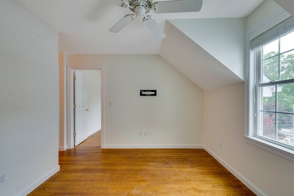 10 Rivard Road, Unit 10 Needham, MA 02492 - Photo 18 of 29 a view of a room with window and a ceiling fan