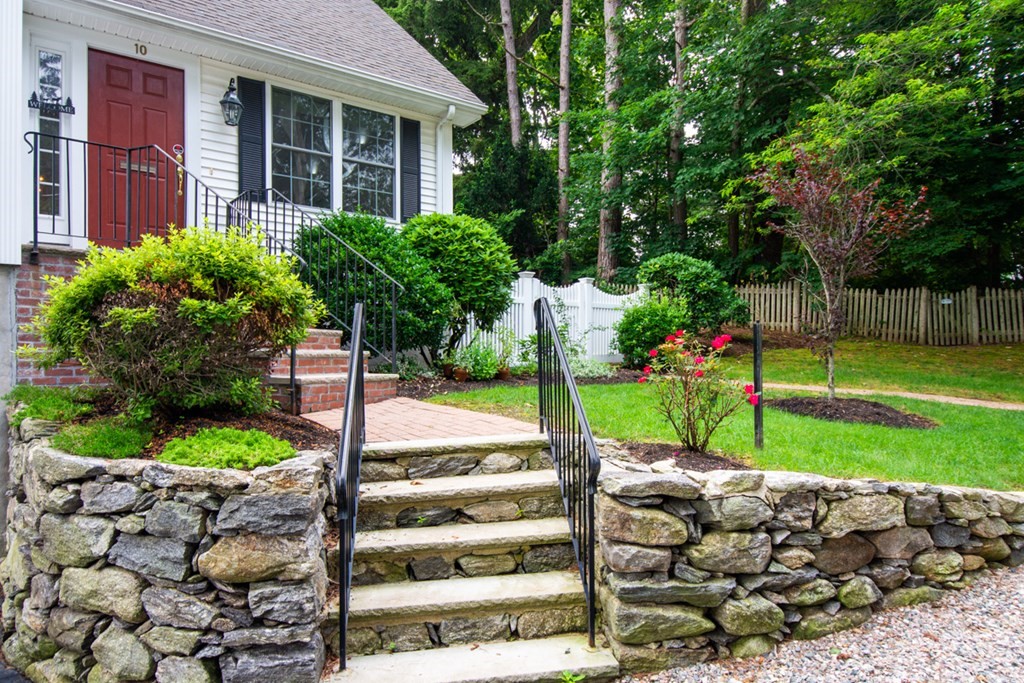 10 Rivard Road, Unit 10 Needham, MA 02492 - Photo 2 of 29 a view of a house with a yard and plants