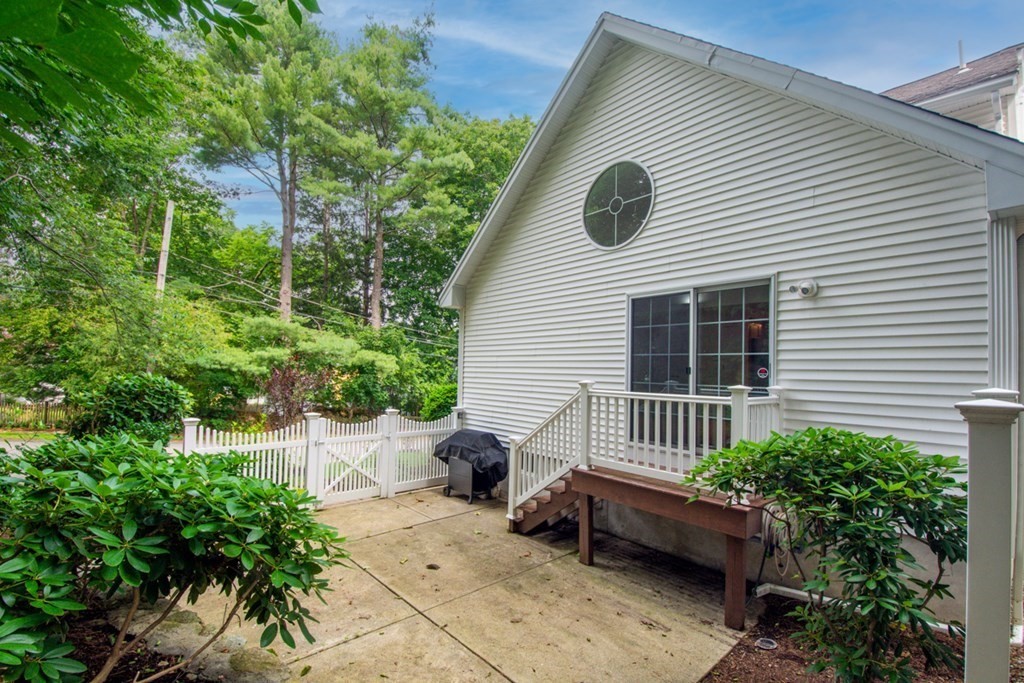 10 Rivard Road, Unit 10 Needham, MA 02492 - Photo 26 of 29 a backyard of a house with lots of green space
